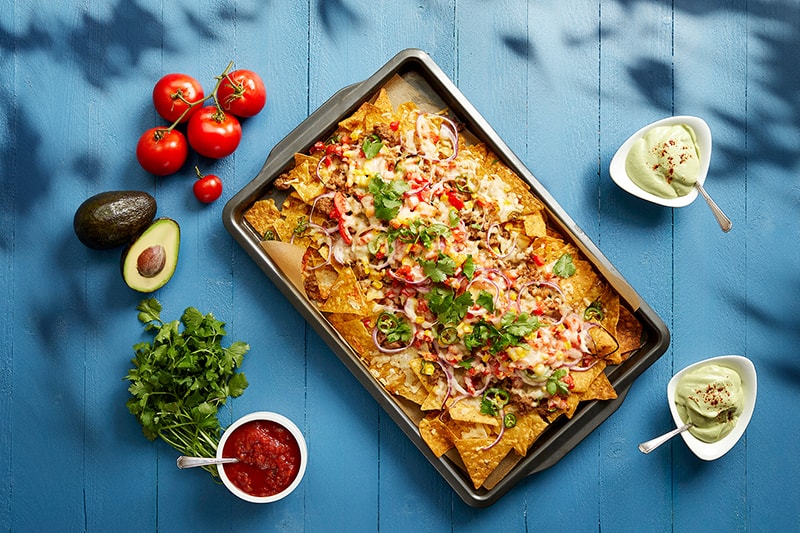 Nachos with the works, avocado and oikos sauce