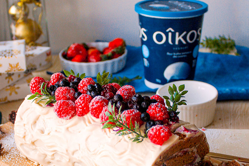 Yule log with berries and light vanilla cream